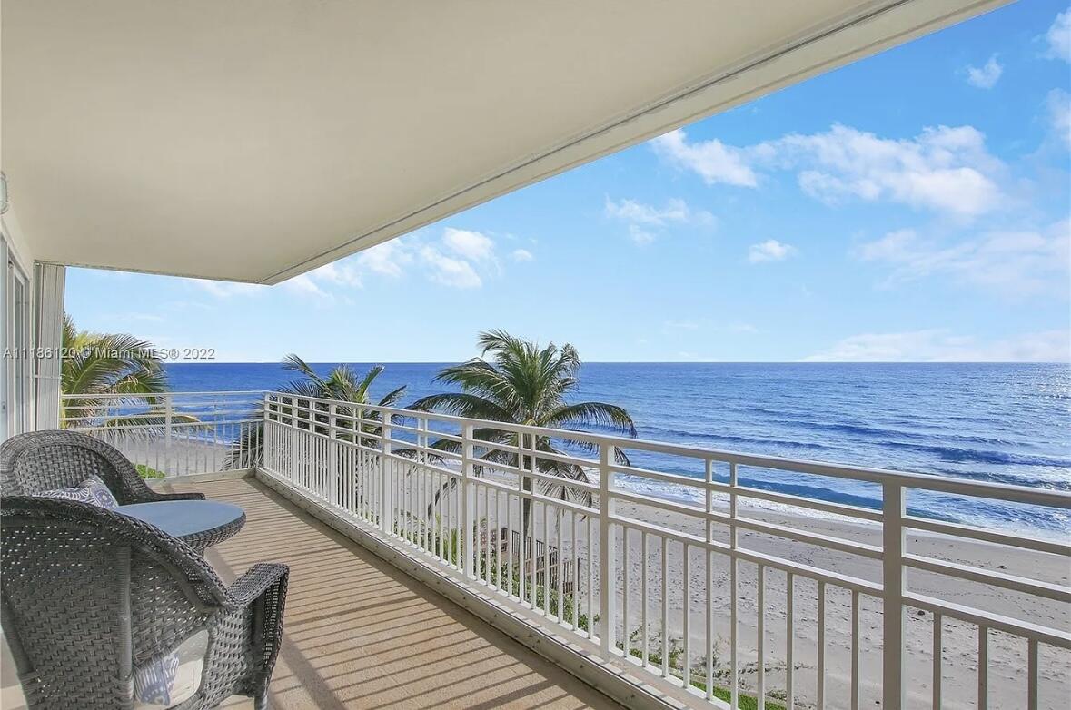 a view of balcony with furniture