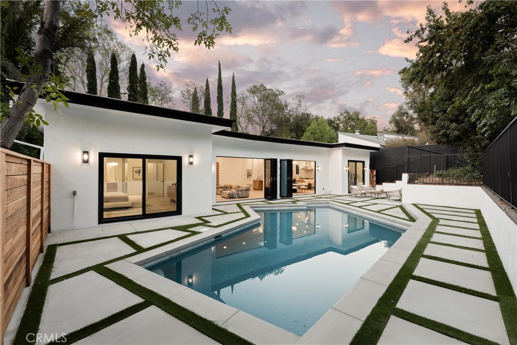 a view of swimming pool with chairs