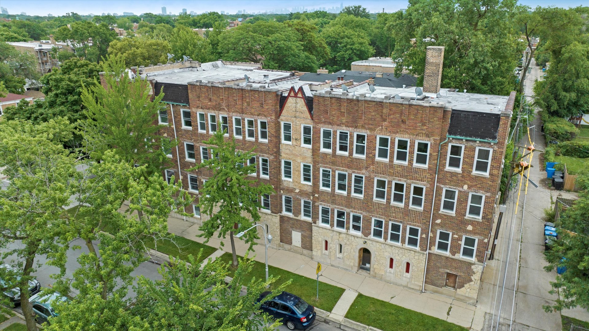 a view of a building with a yard