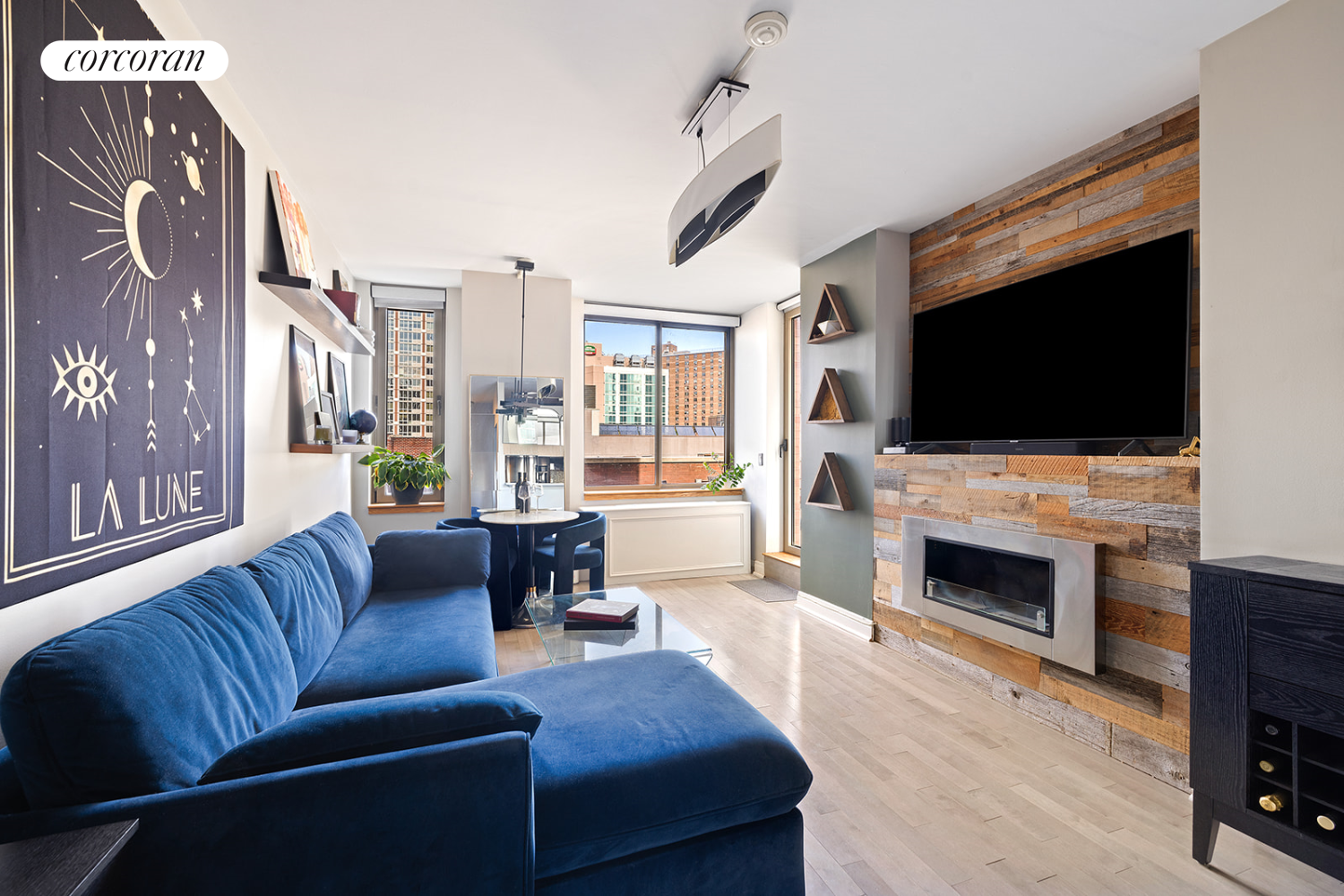 a living room with fireplace furniture and a flat screen tv