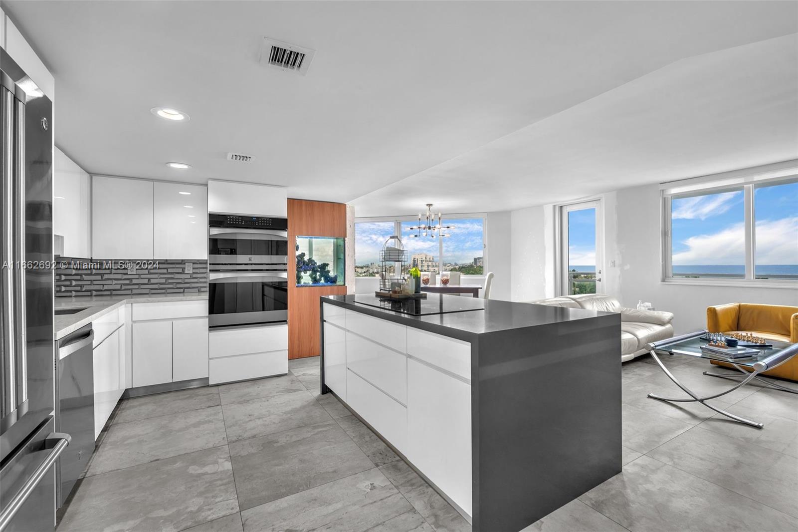 a kitchen with stainless steel appliances and white cabinets