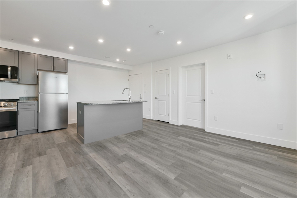 a view of kitchen with wooden floor