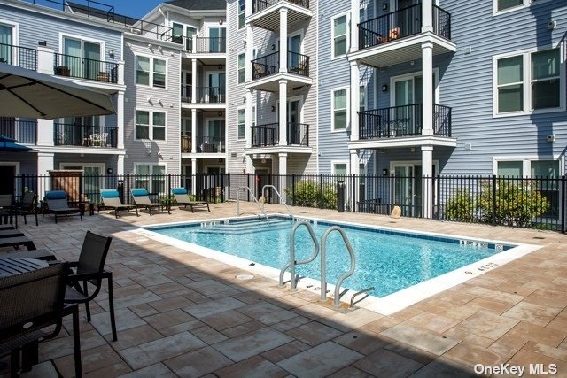 a view of outdoor space yard swimming pool and sitting area