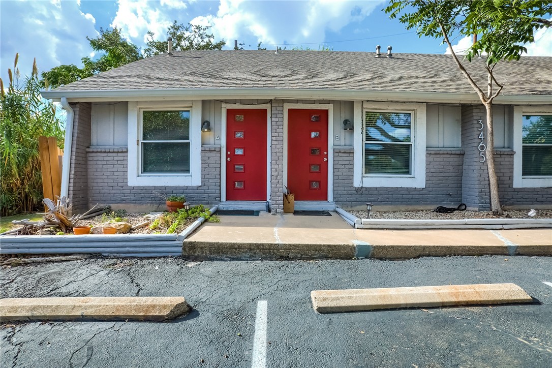 a view of a house with small yard