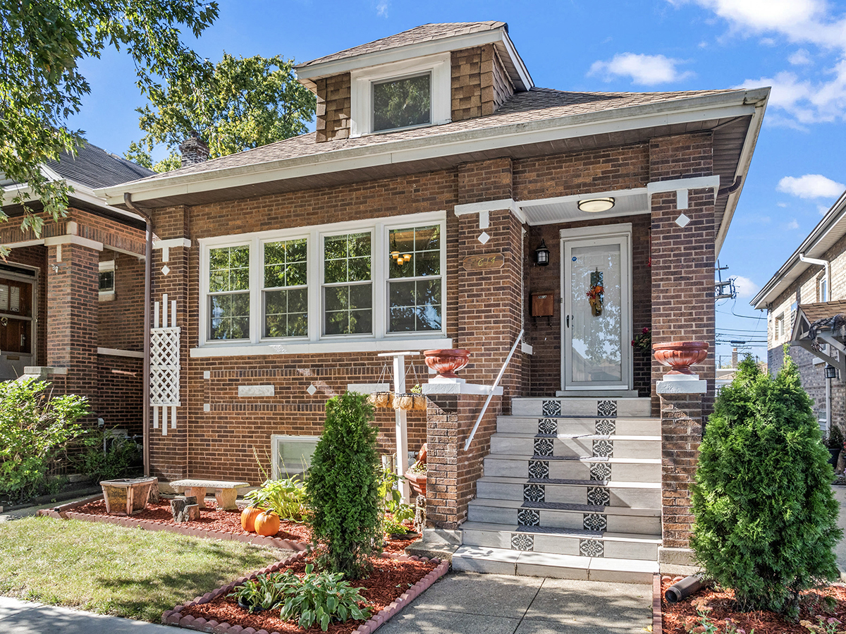 front view of a house with a yard