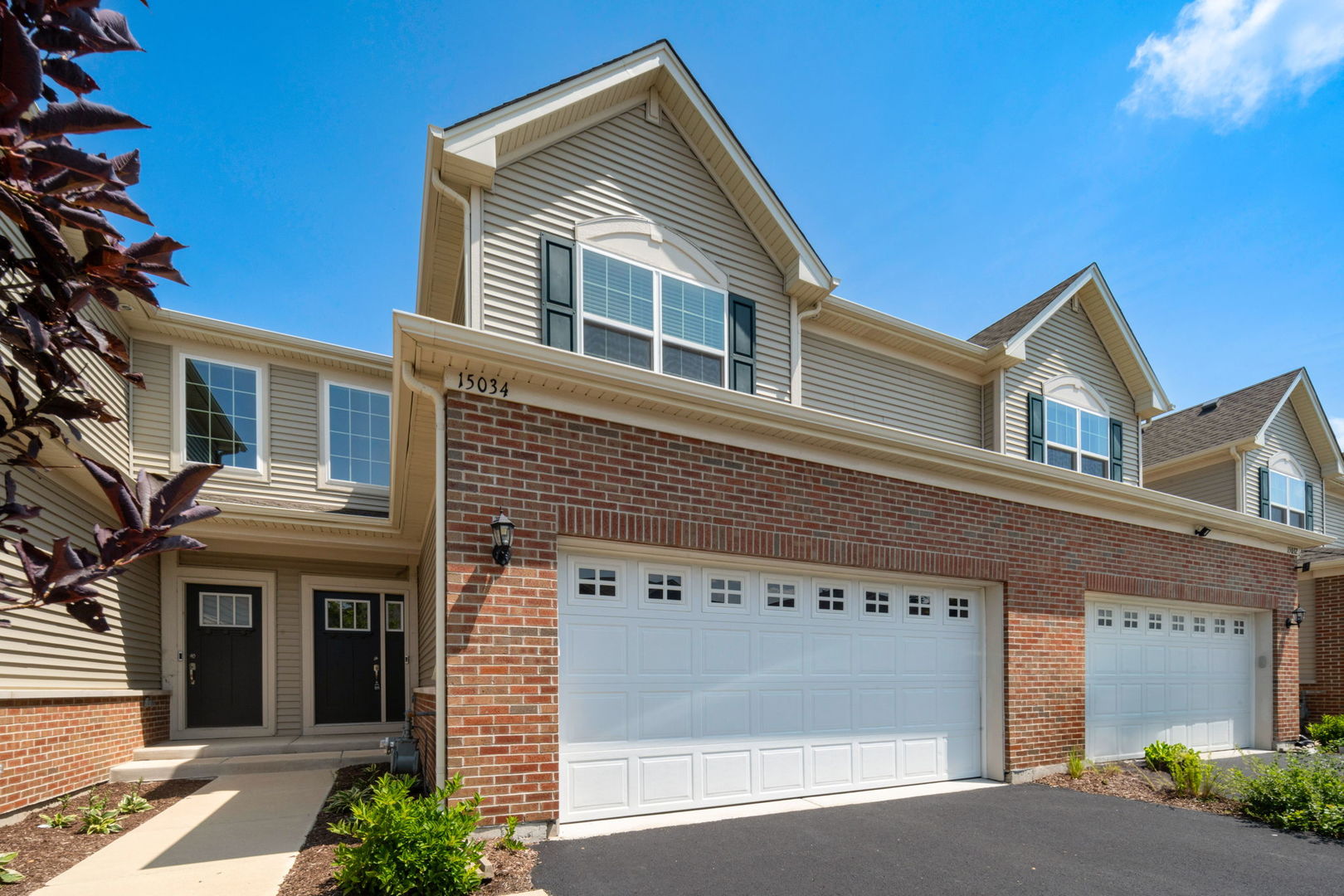 a front view of a house with a garage