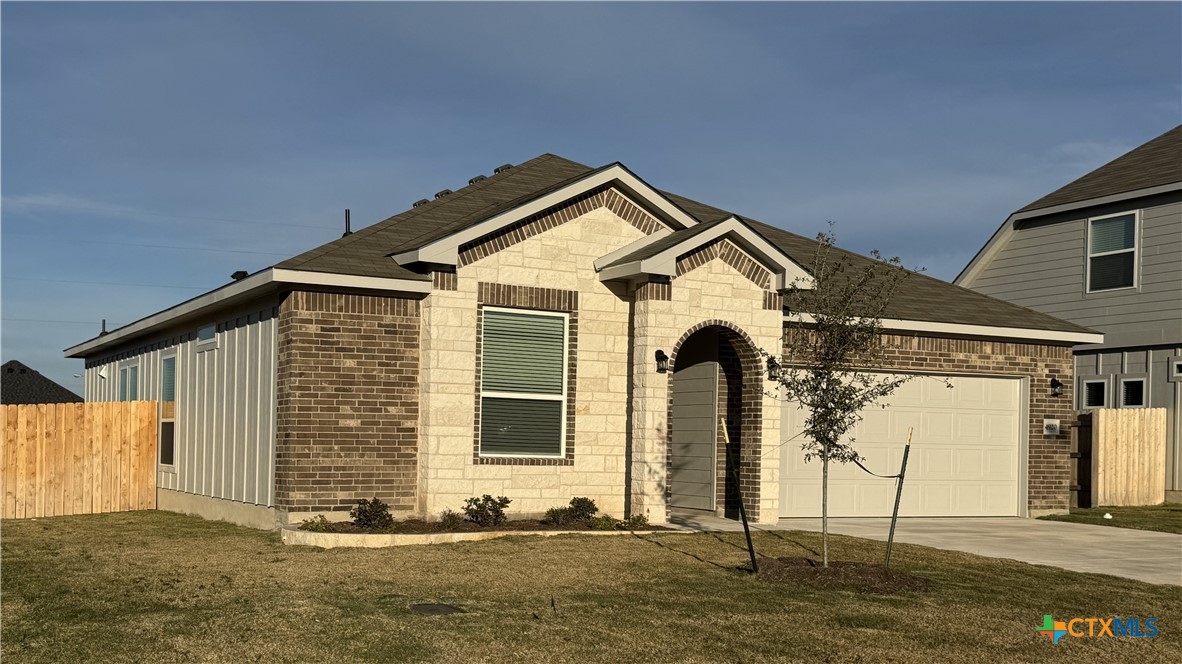 a front view of a house with garage