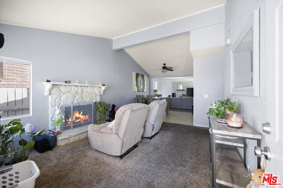 a living room with furniture and flowers