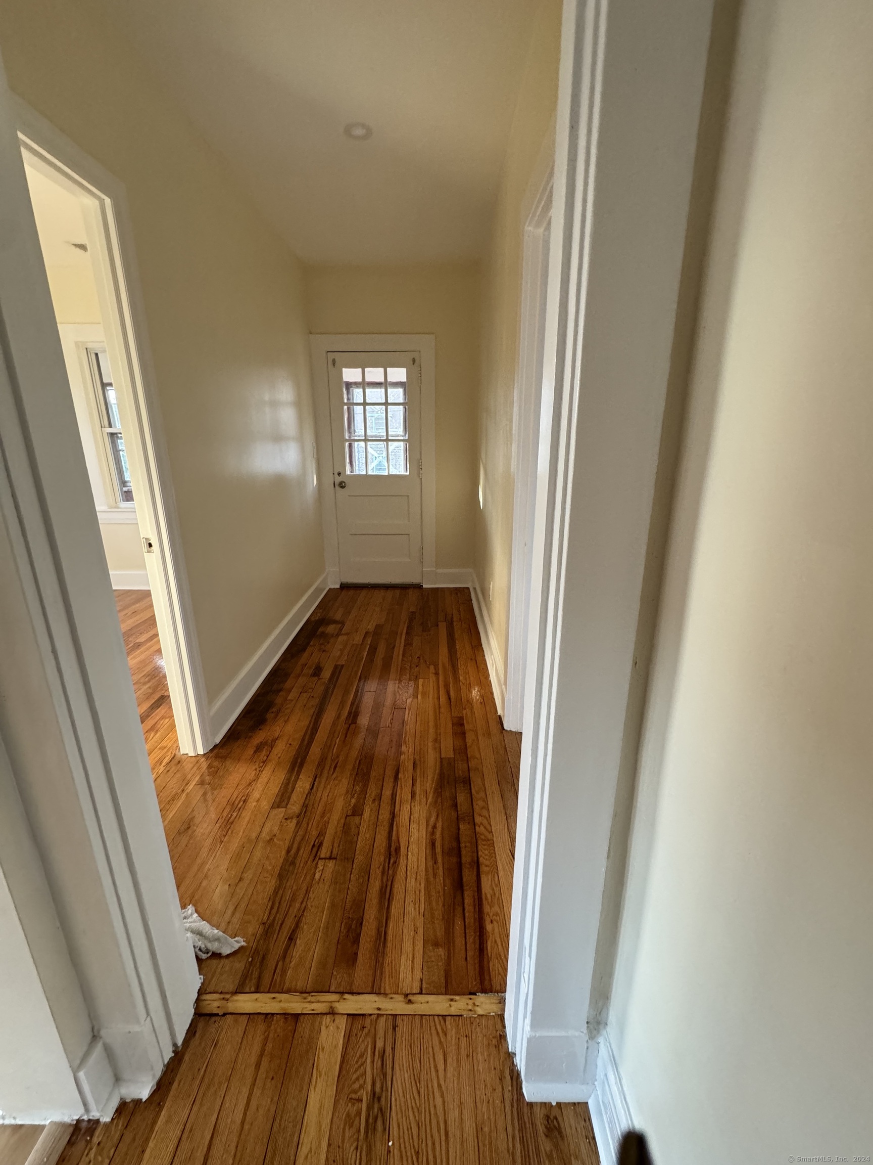 a view of wooden floor in an empty room