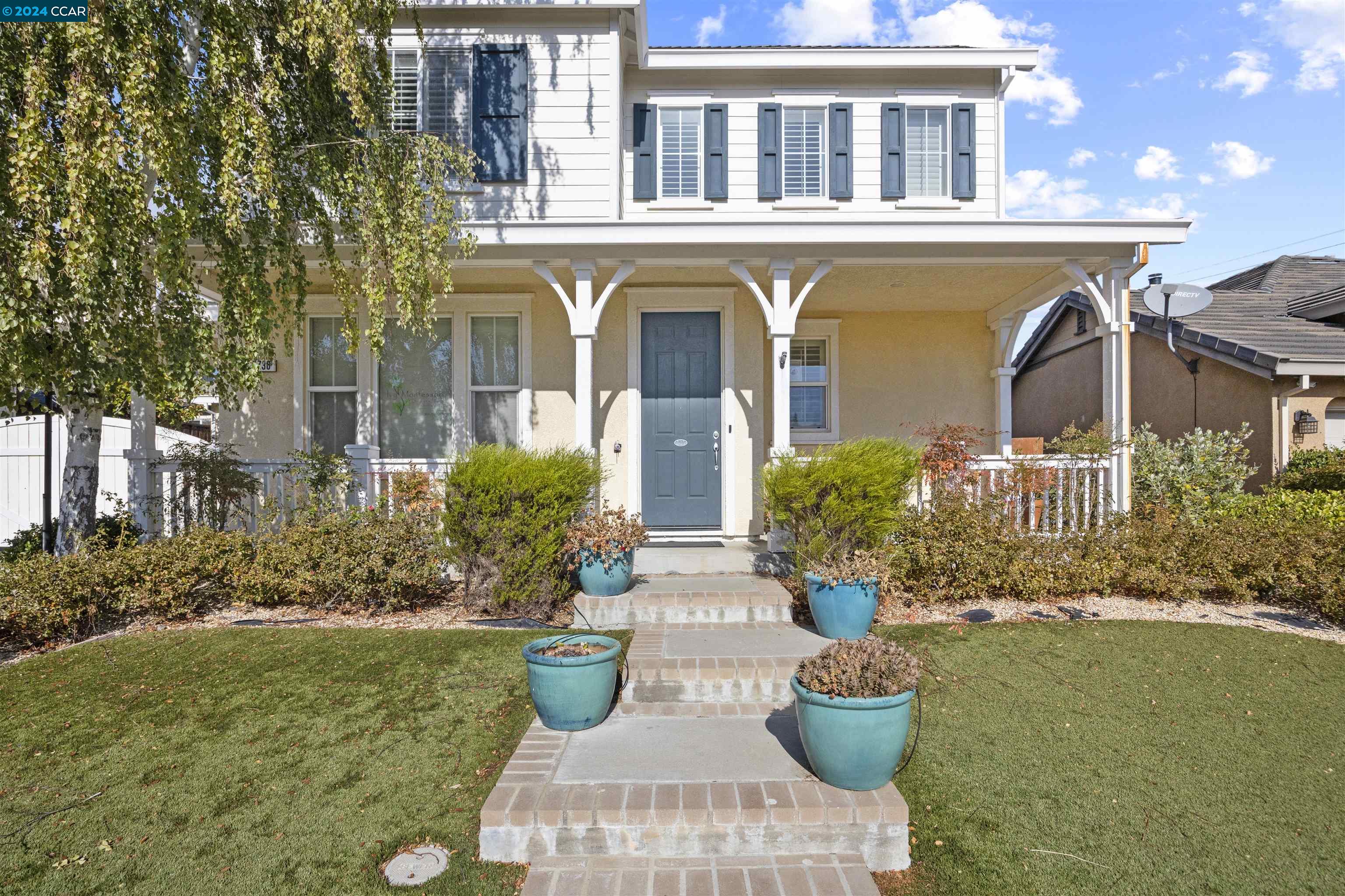 a front view of a house with garden