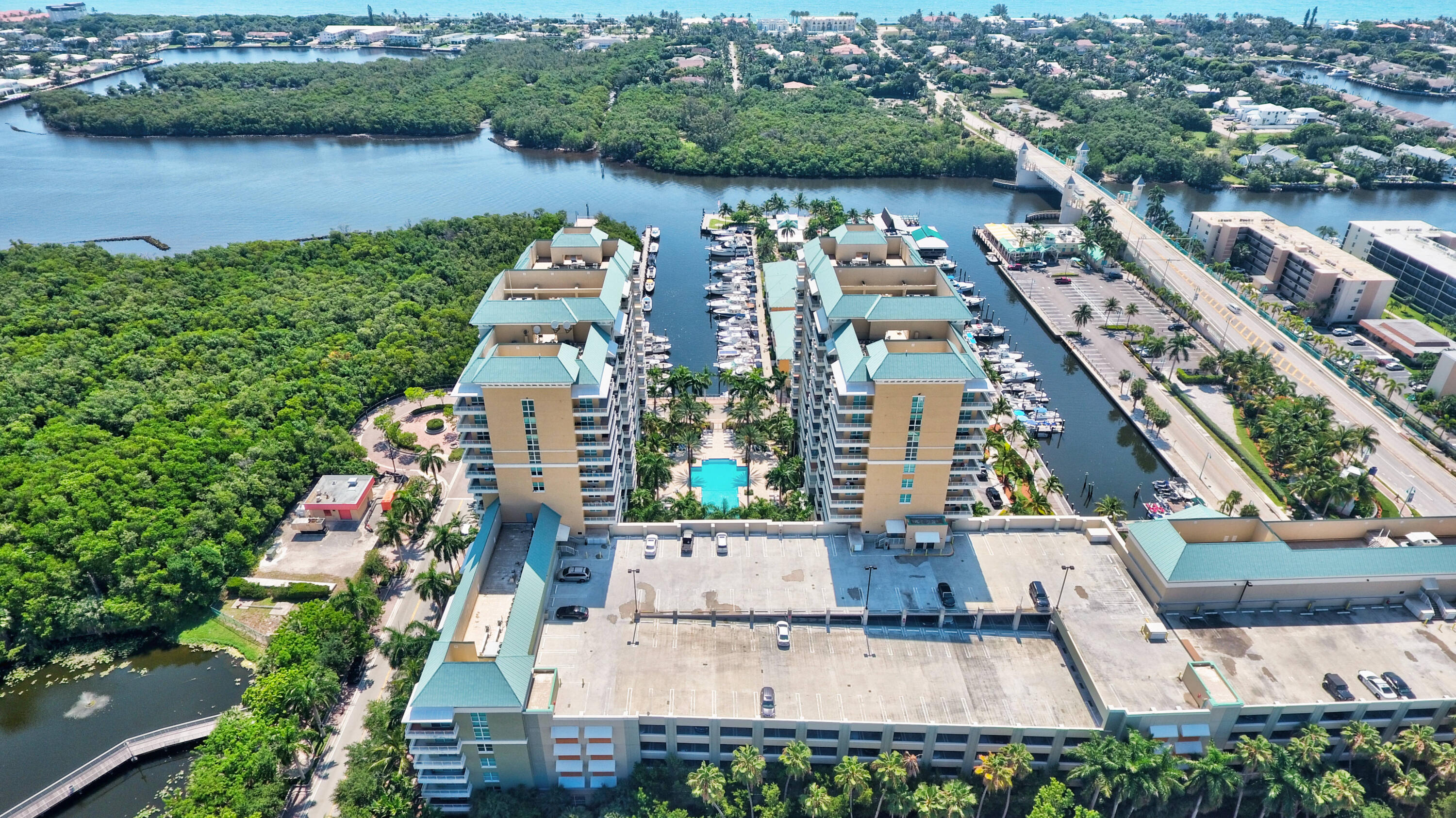 an aerial view of house with yard and lake view