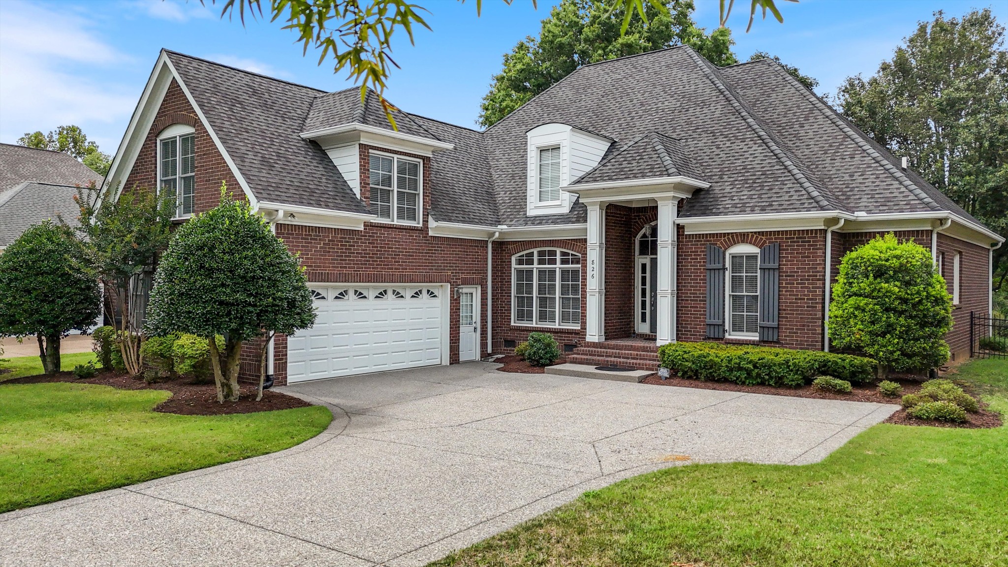 front view of a house with a yard