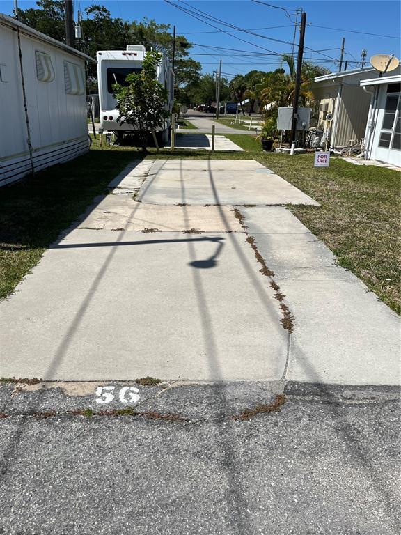 a view of a swimming pool with a yard