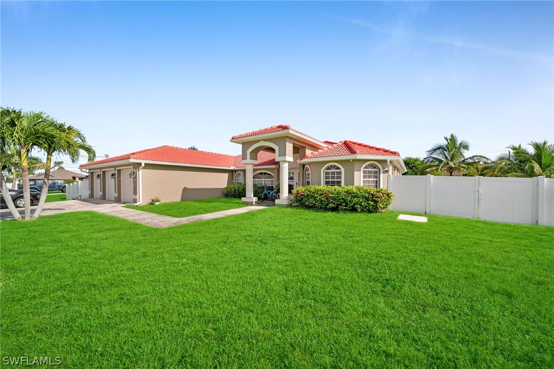 a front view of a house with a yard