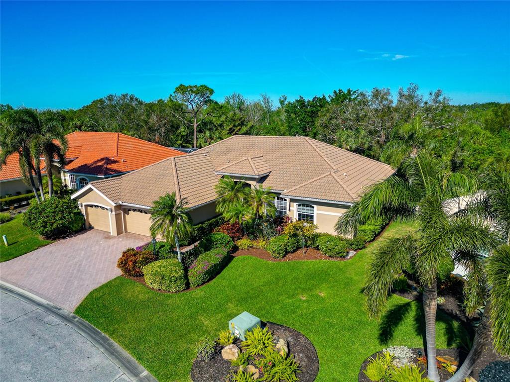 Preserve, partial lake view over private pool, 3 car garage in gated West Hampton.