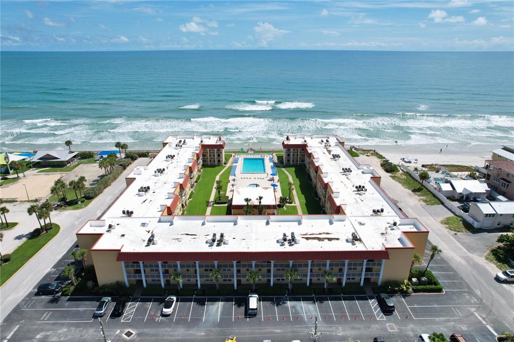 a view of a swimming pool with furniture