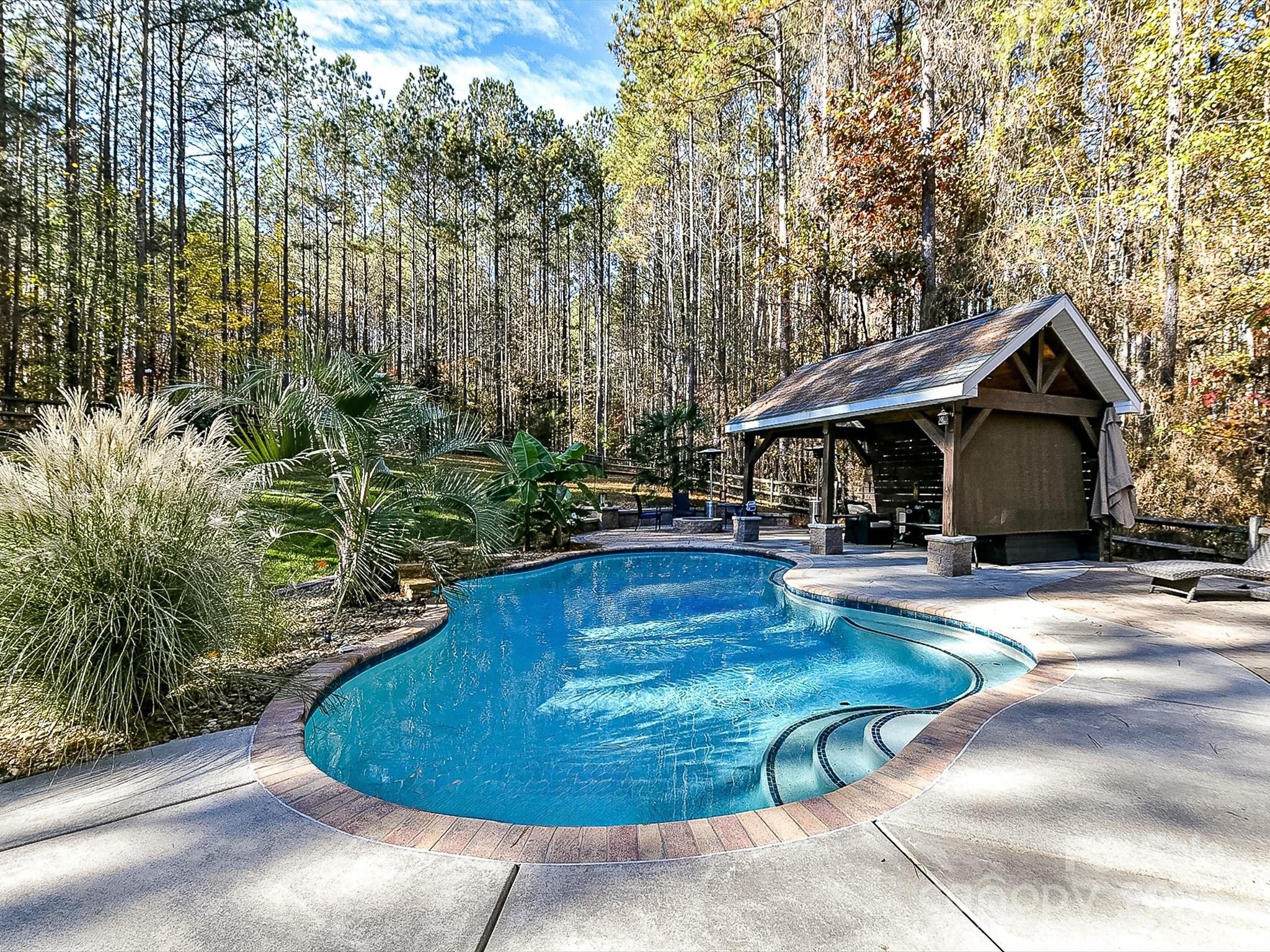 a view of a house with swimming pool