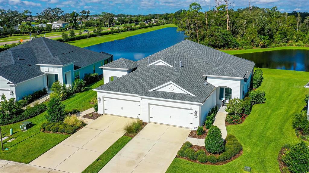 a aerial view of a house with a yard