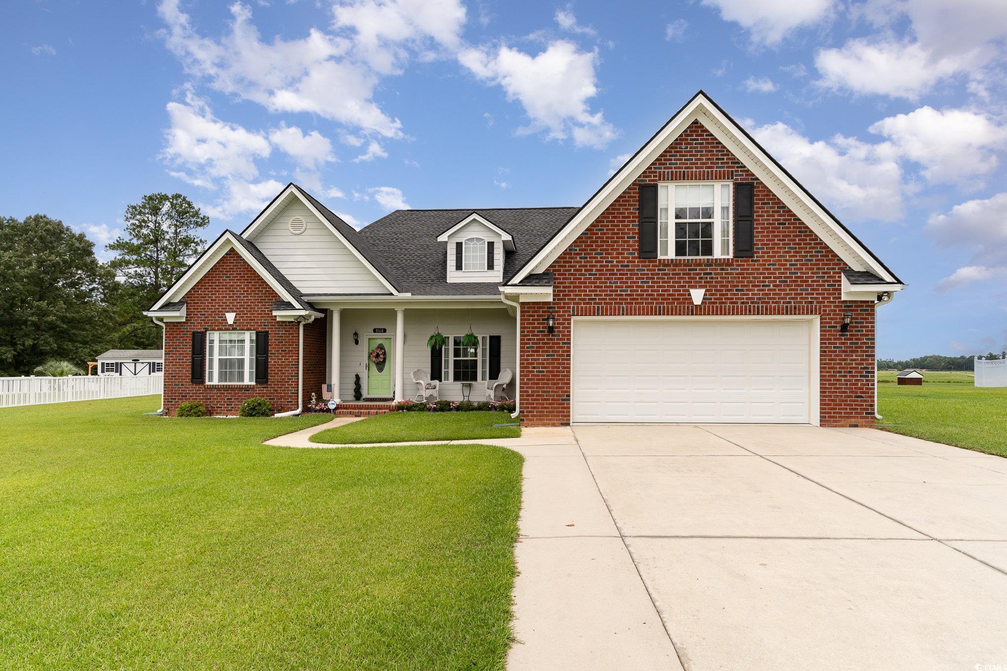 View of front of home featuring a garage and a fro