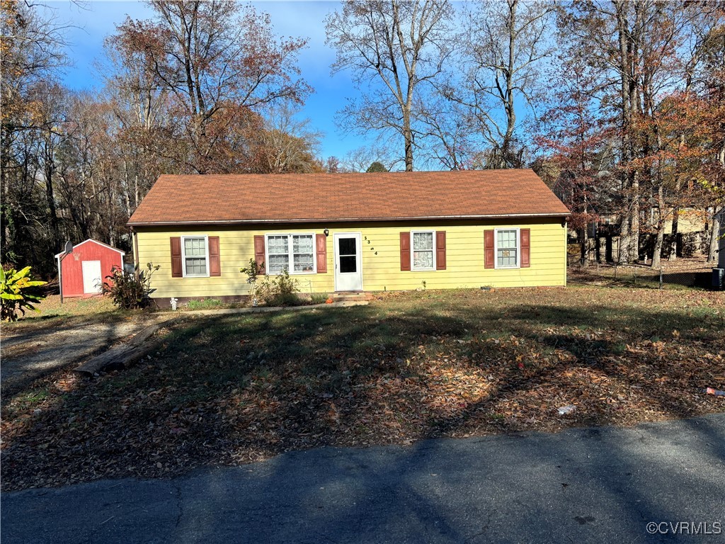 View of front of property with a front yard and a