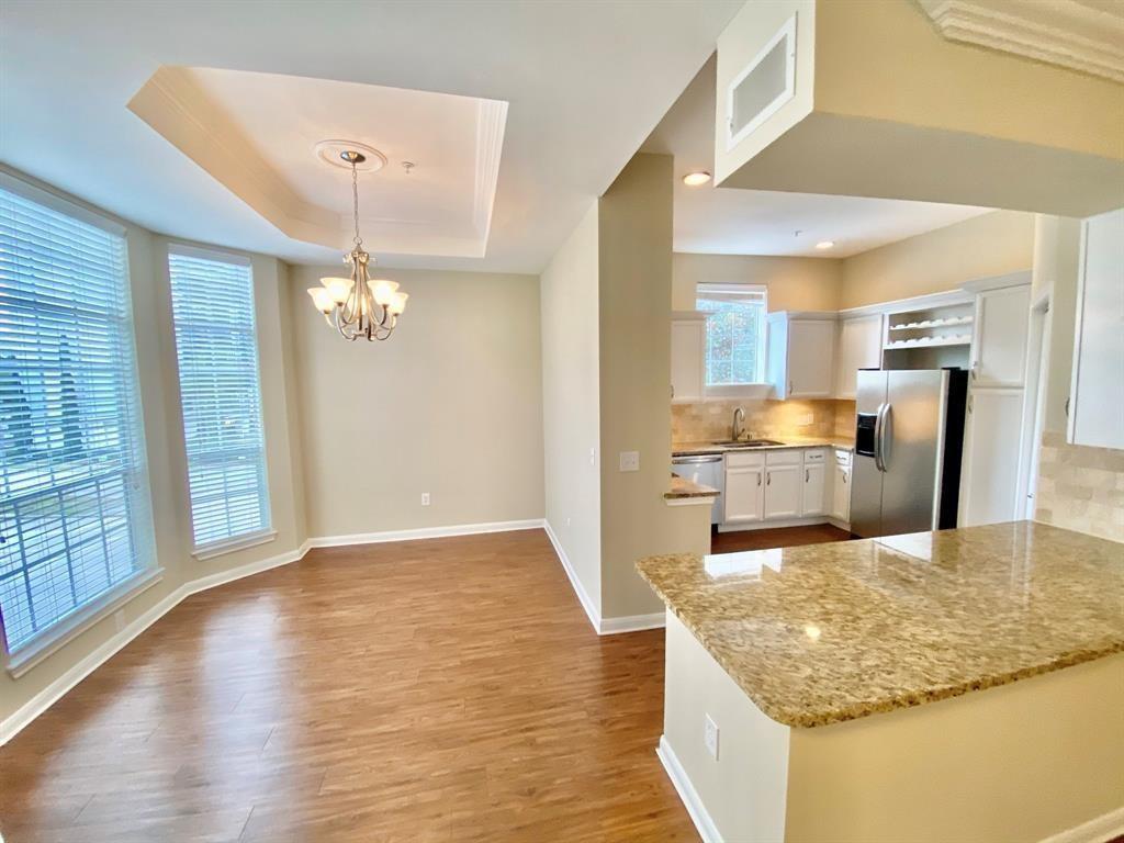 a view of a kitchen with granite countertop