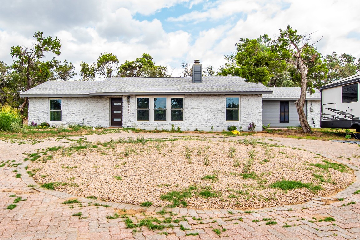 a house with trees in the background