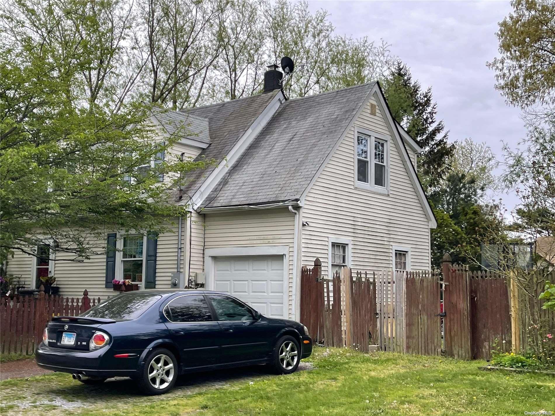 a car parked in front of a house