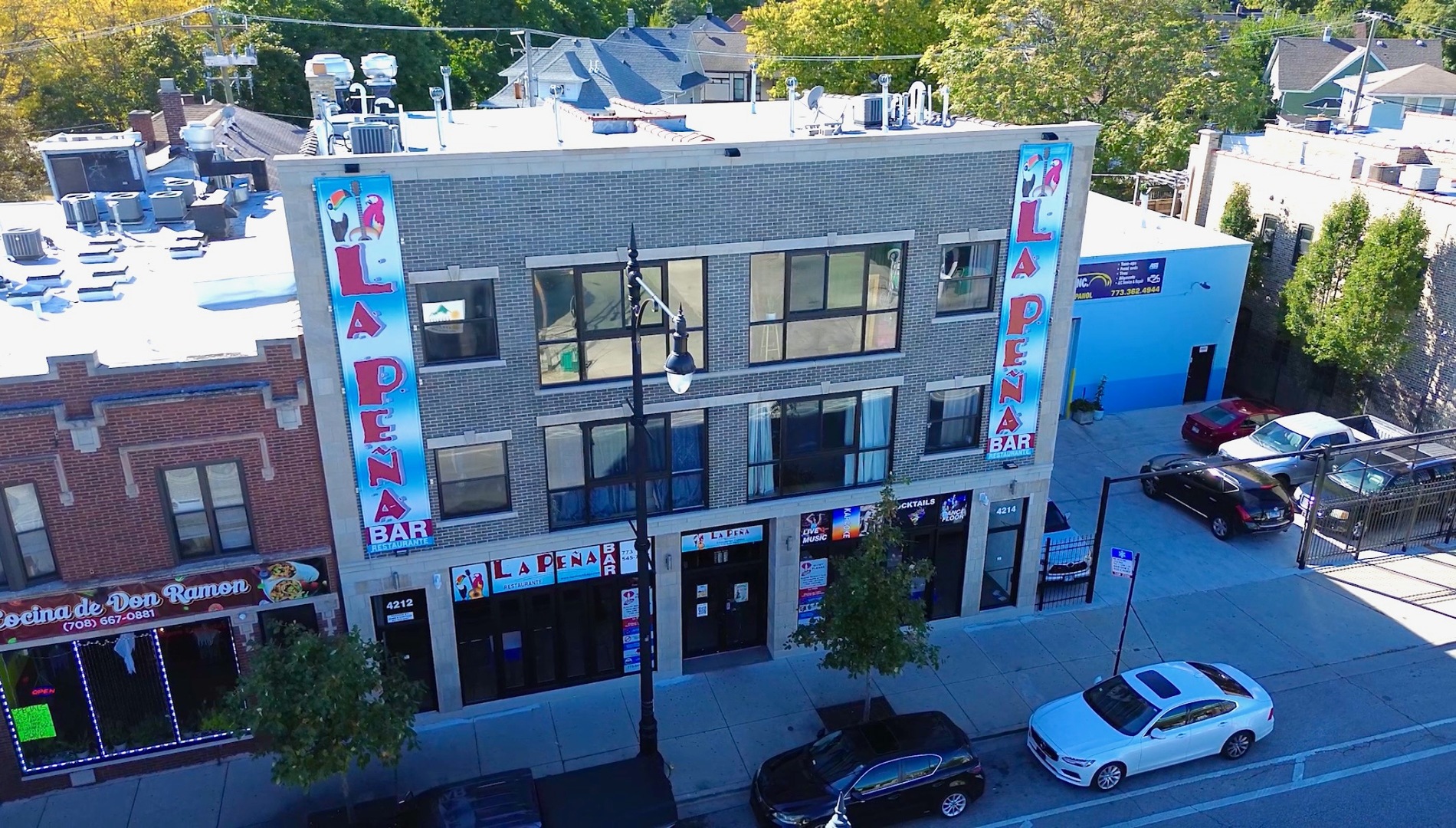 a front view of a building with retail shops