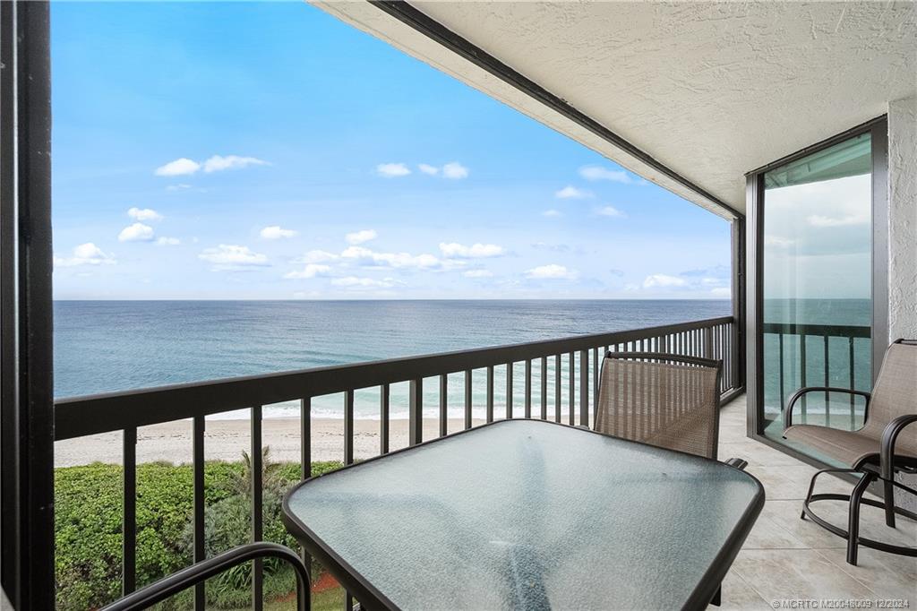 a view of balcony with furniture