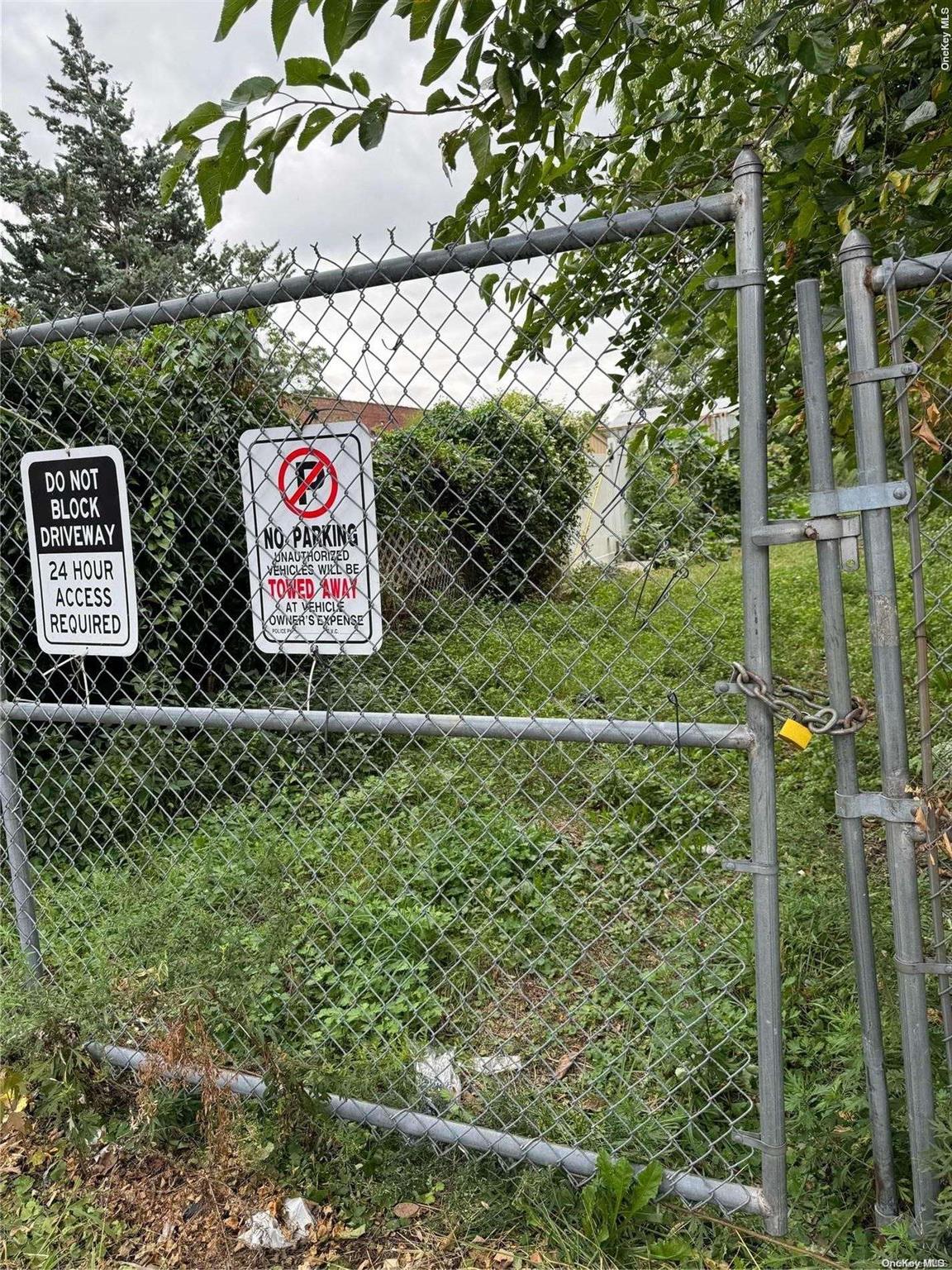 a view of a wooden fence and a sign board