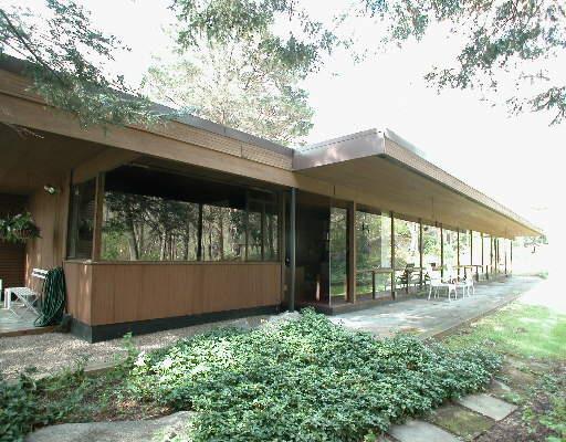 an outdoor view of house with green space