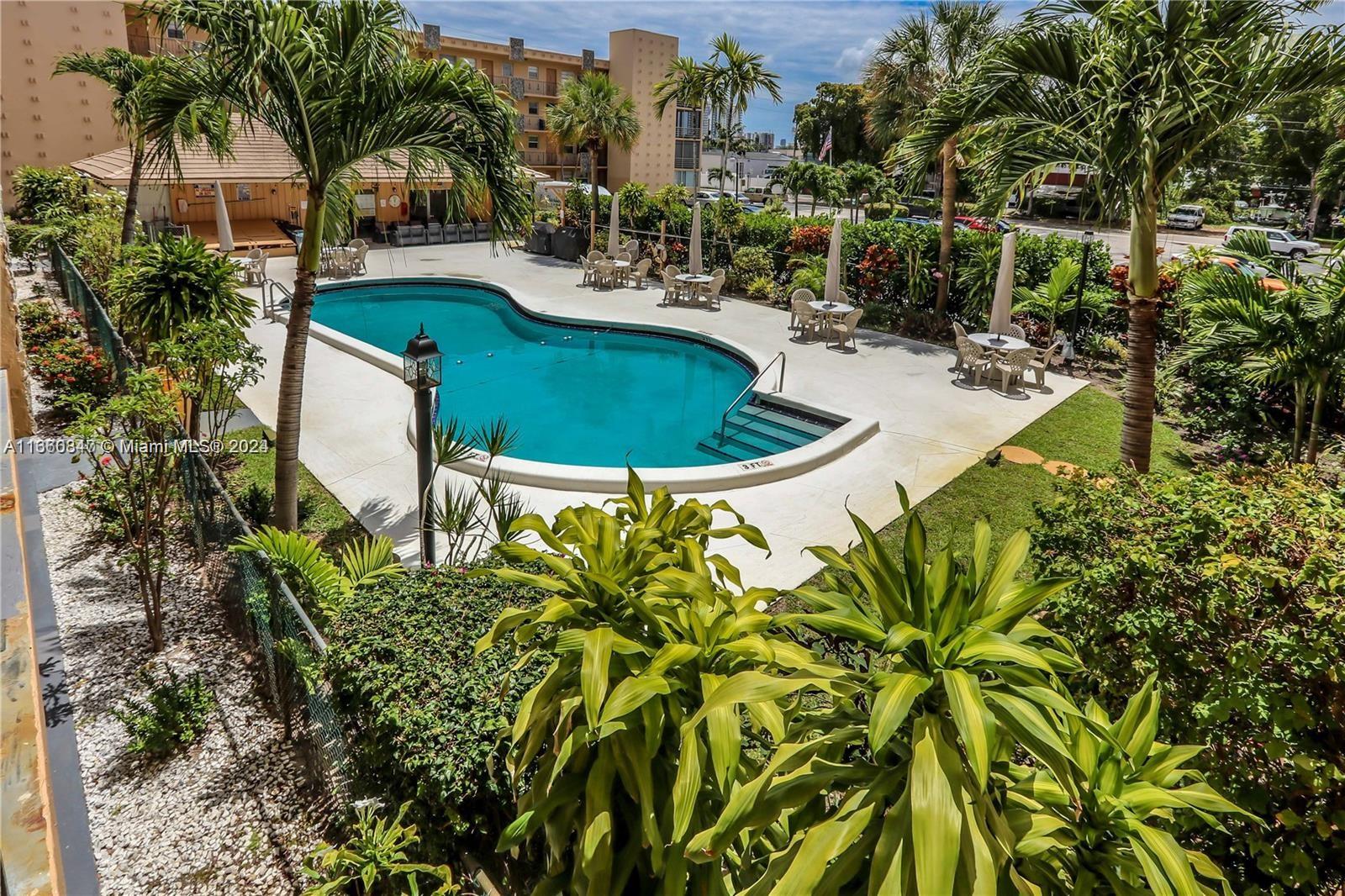 a view of a swimming pool with a patio