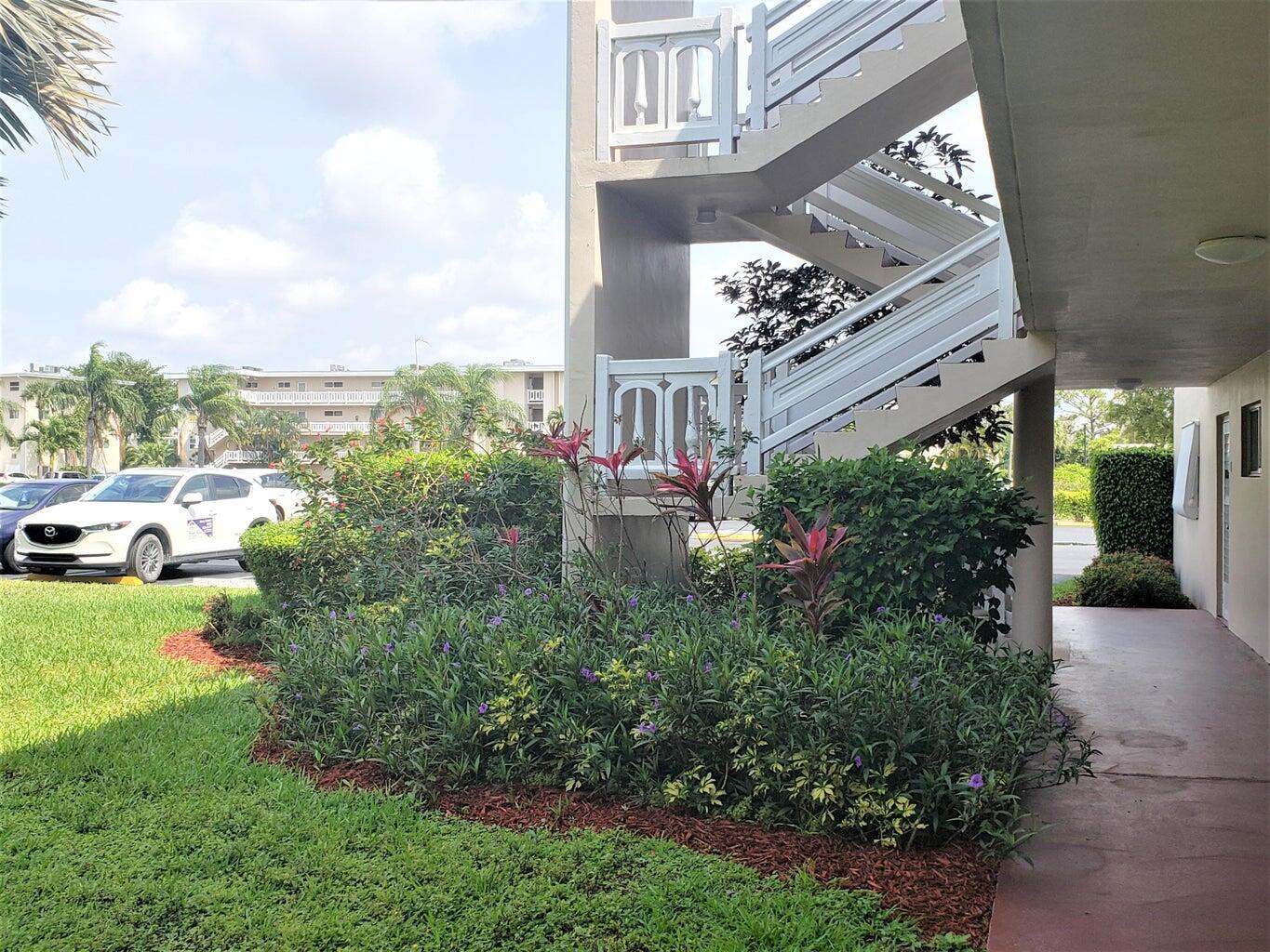 a view of a couches and dinning table in patio