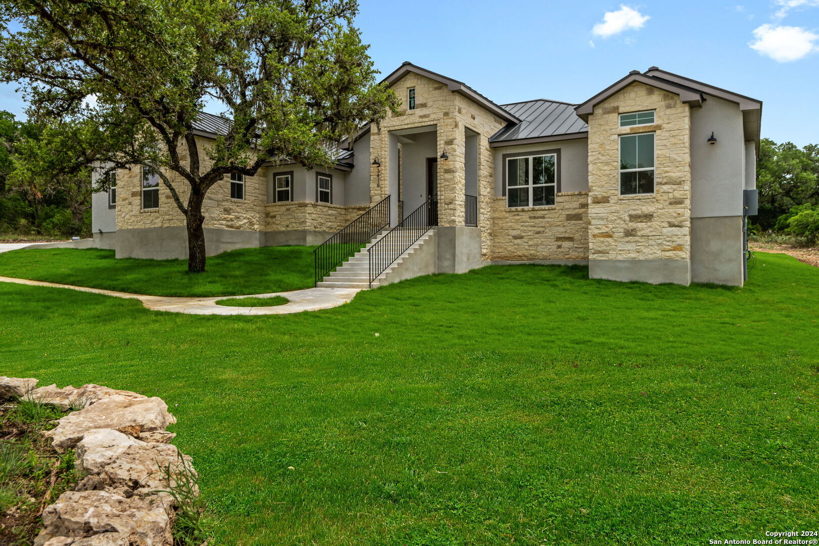 a front view of a house with a yard