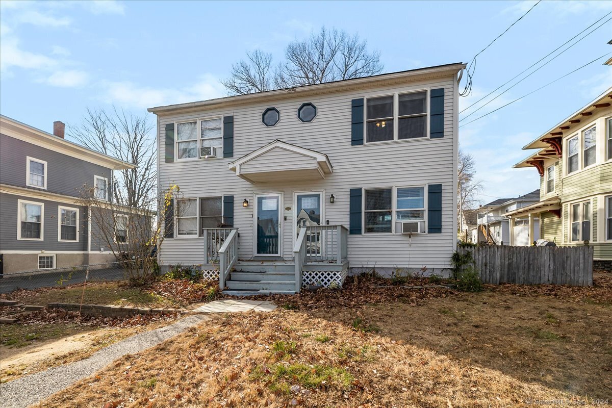 a front view of a house with stairs