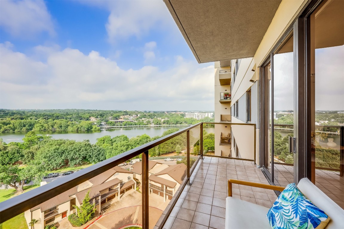 a view of balcony with furniture