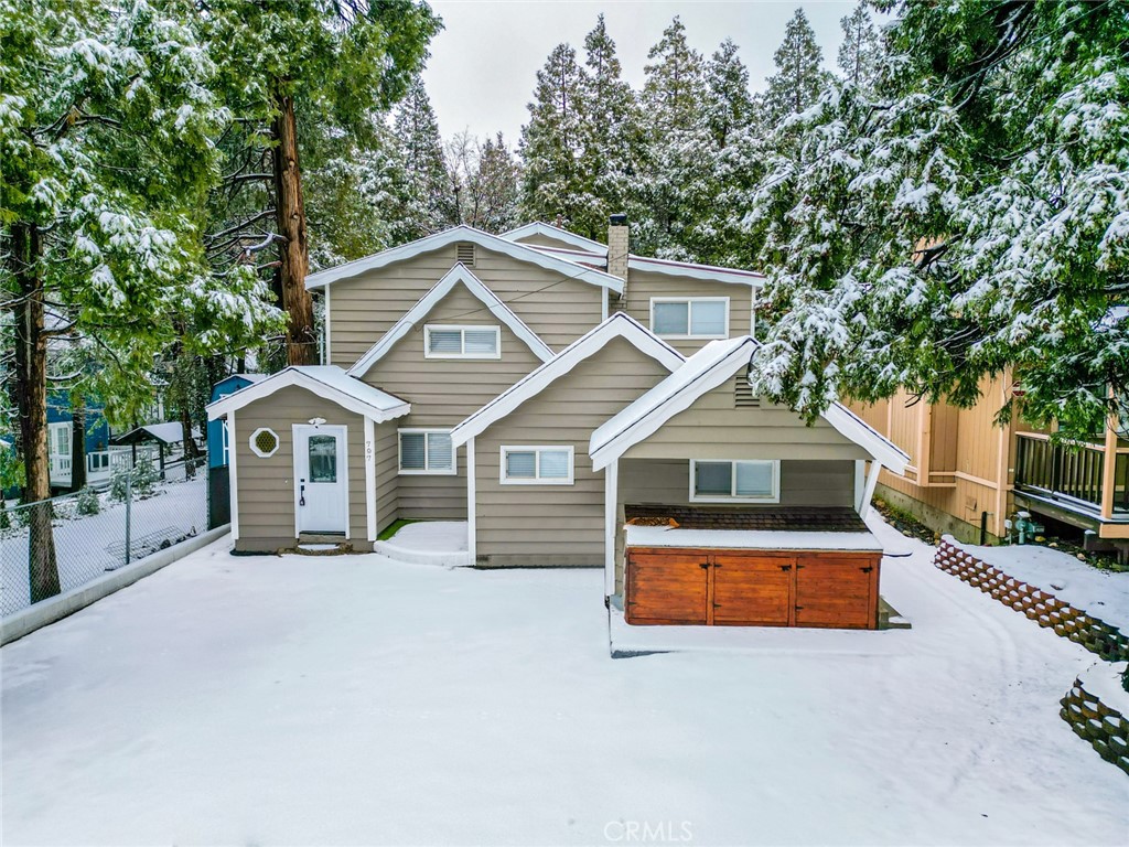 a front view of a house with yard and garage