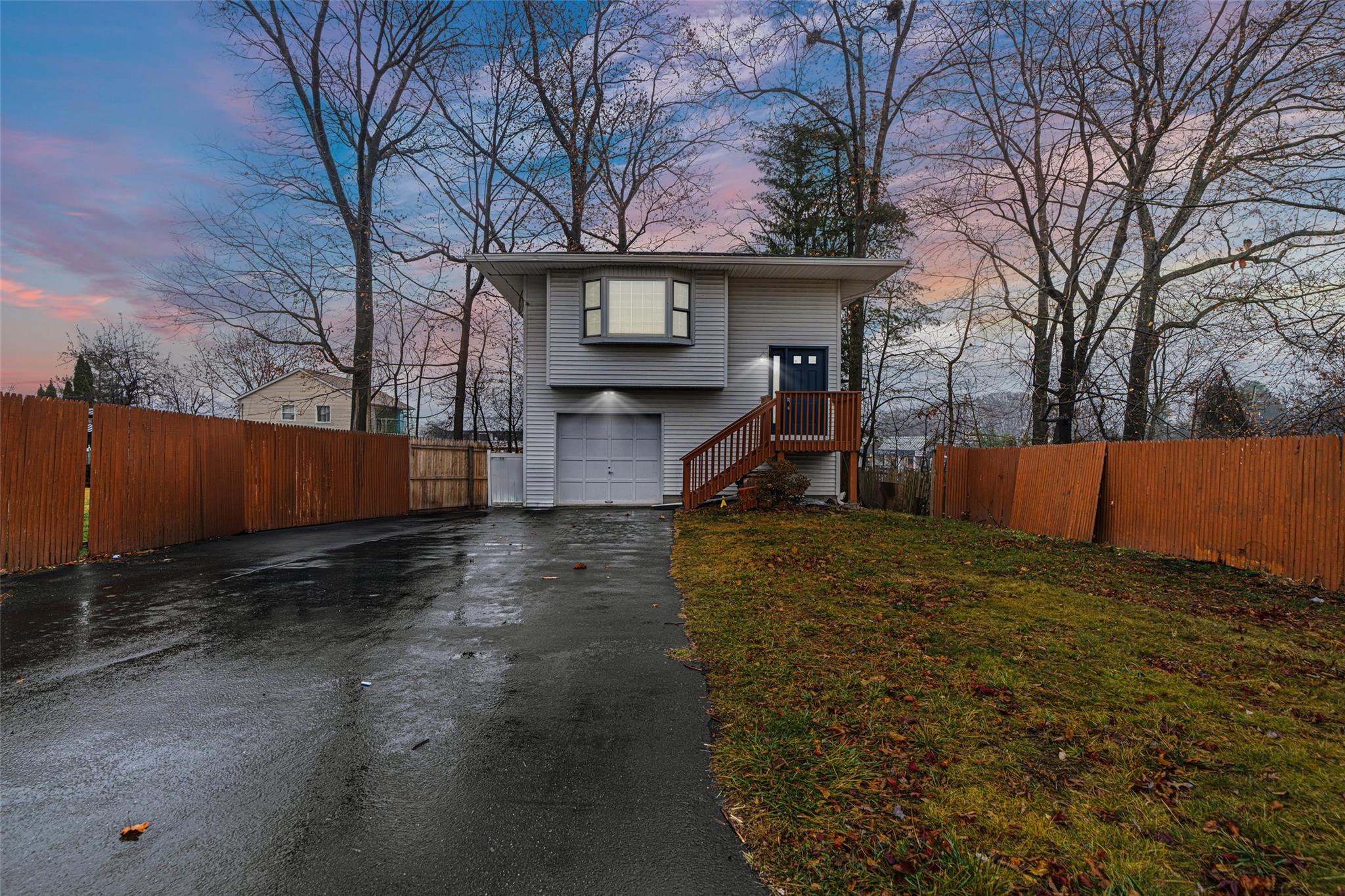 a view of a house with a yard