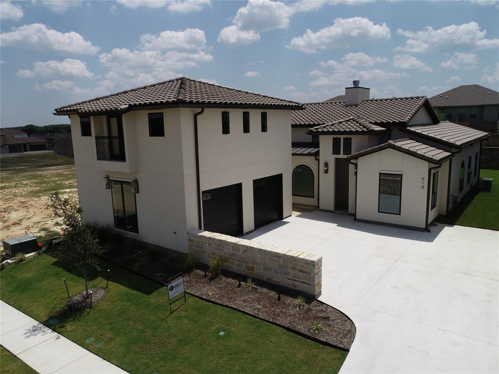 a aerial view of a house with a yard