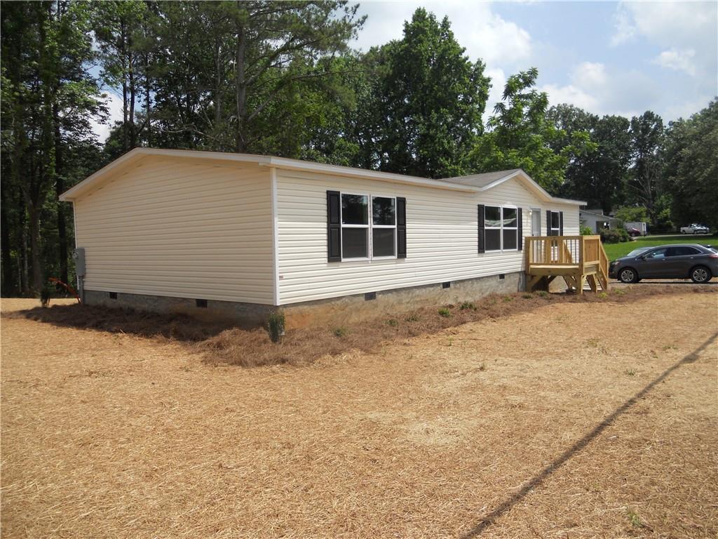 a house with trees in the background