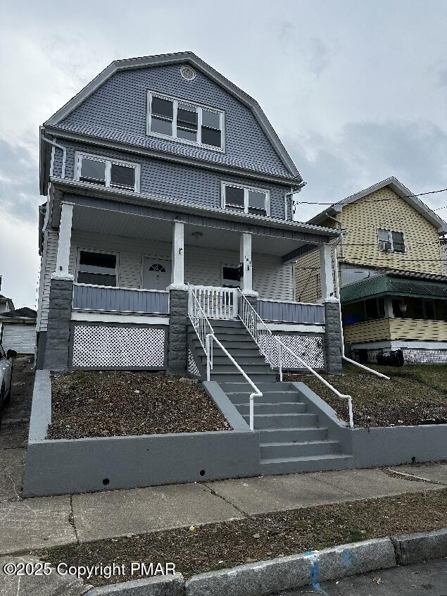 a front view of a house with garage