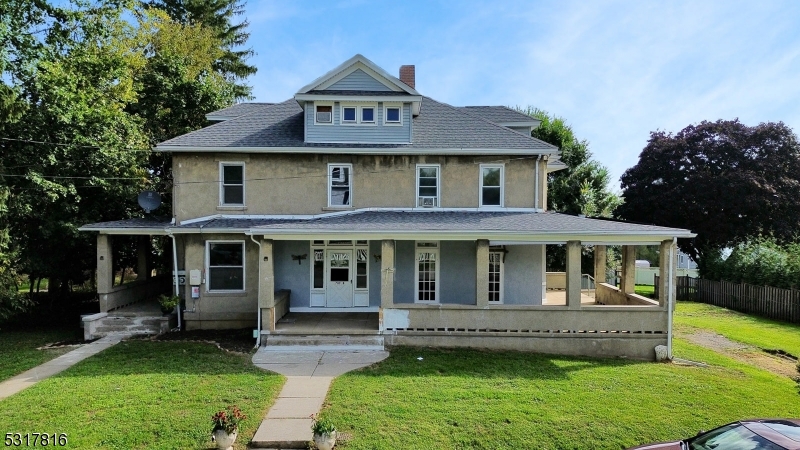 a view of house with yard