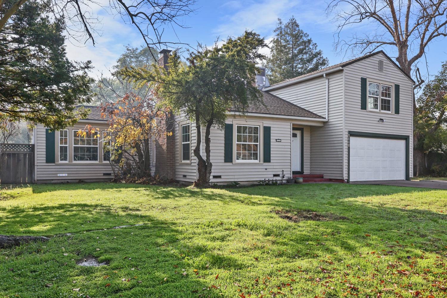 a view of a house with a yard