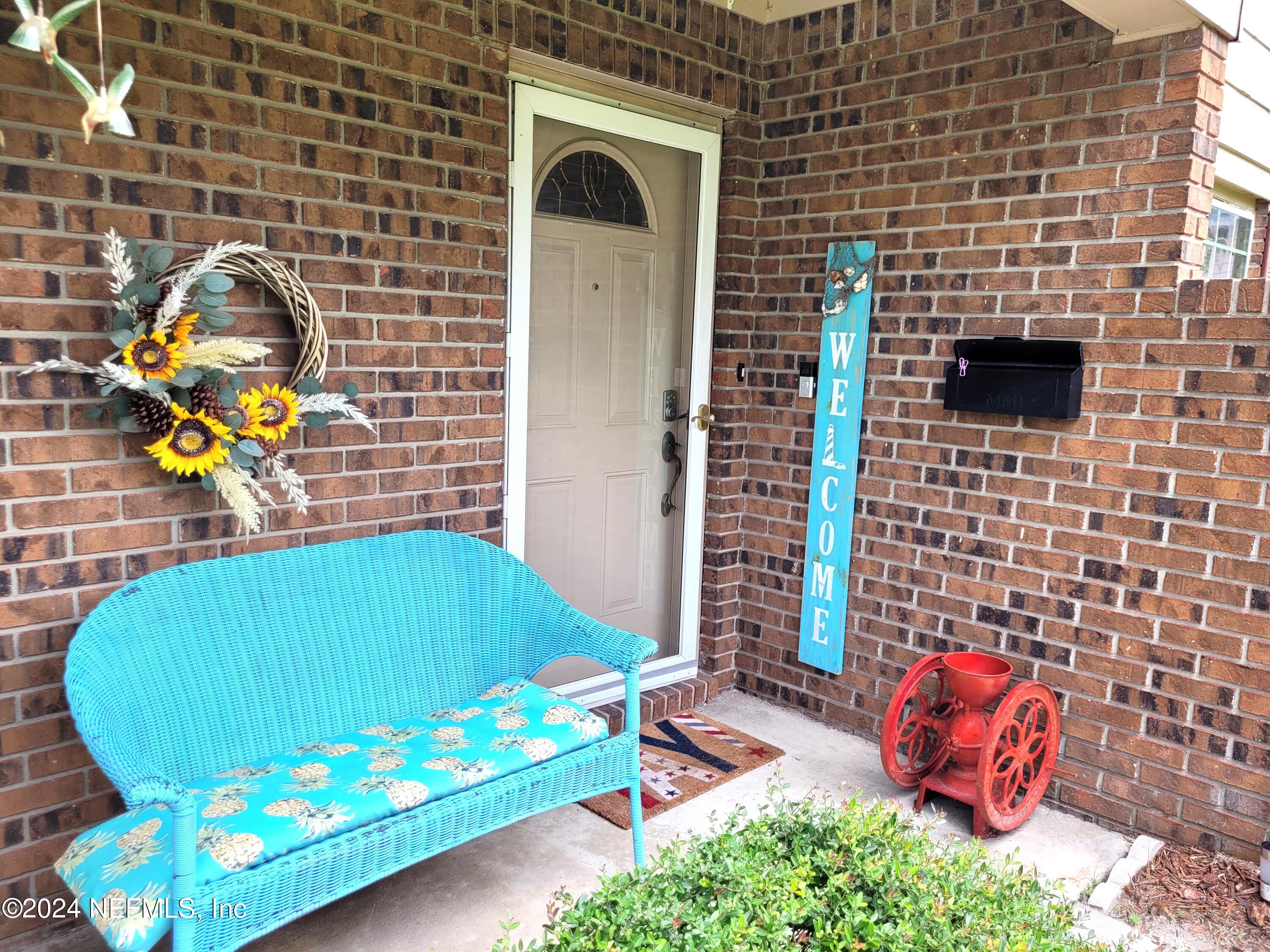 a backyard of a house with outdoor seating