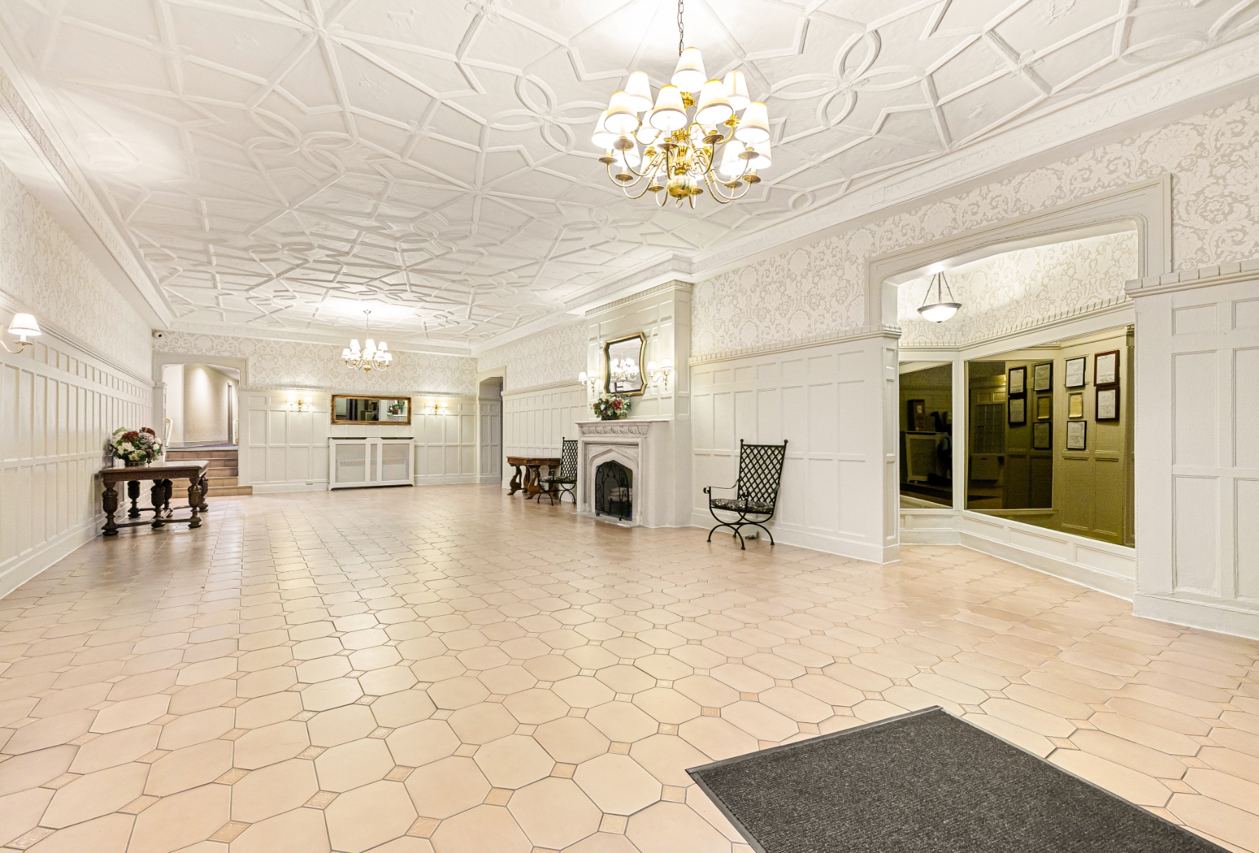 a view of a livingroom with furniture and a chandelier