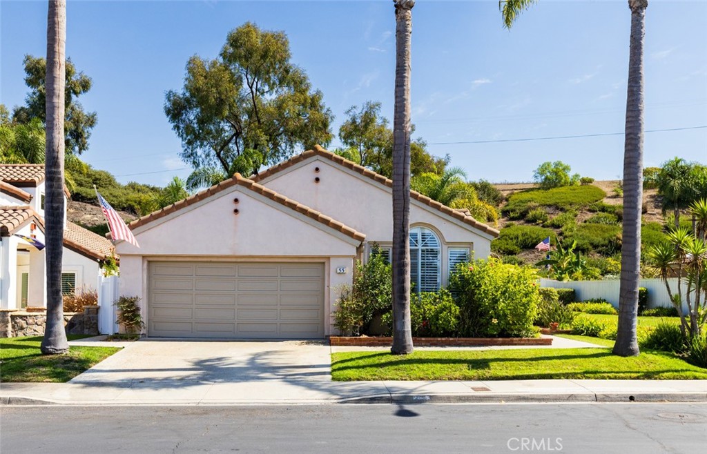 a house that has a tree in front of it