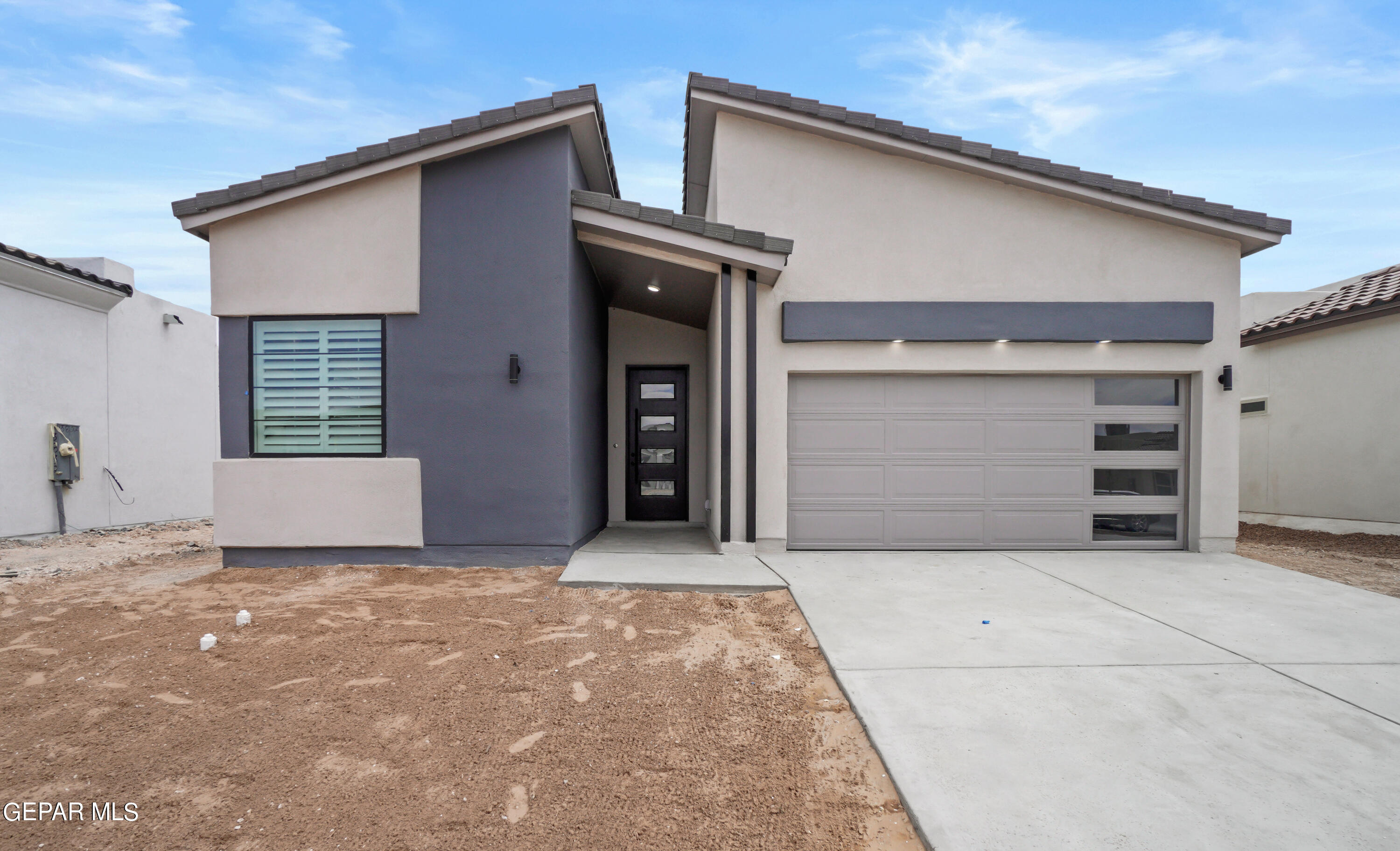 a view of house with garage