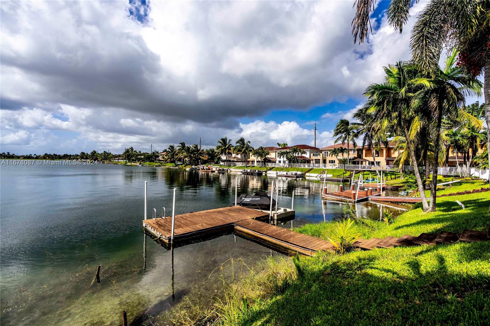 a view of a lake with a house in the background