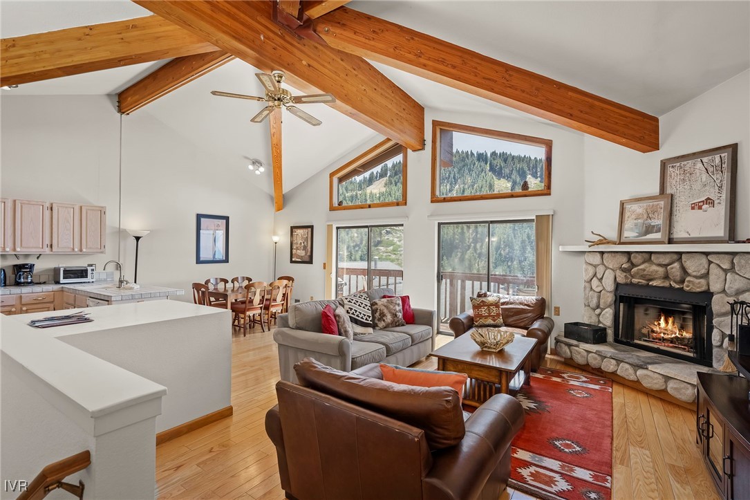 a living room with furniture fireplace and flat screen tv