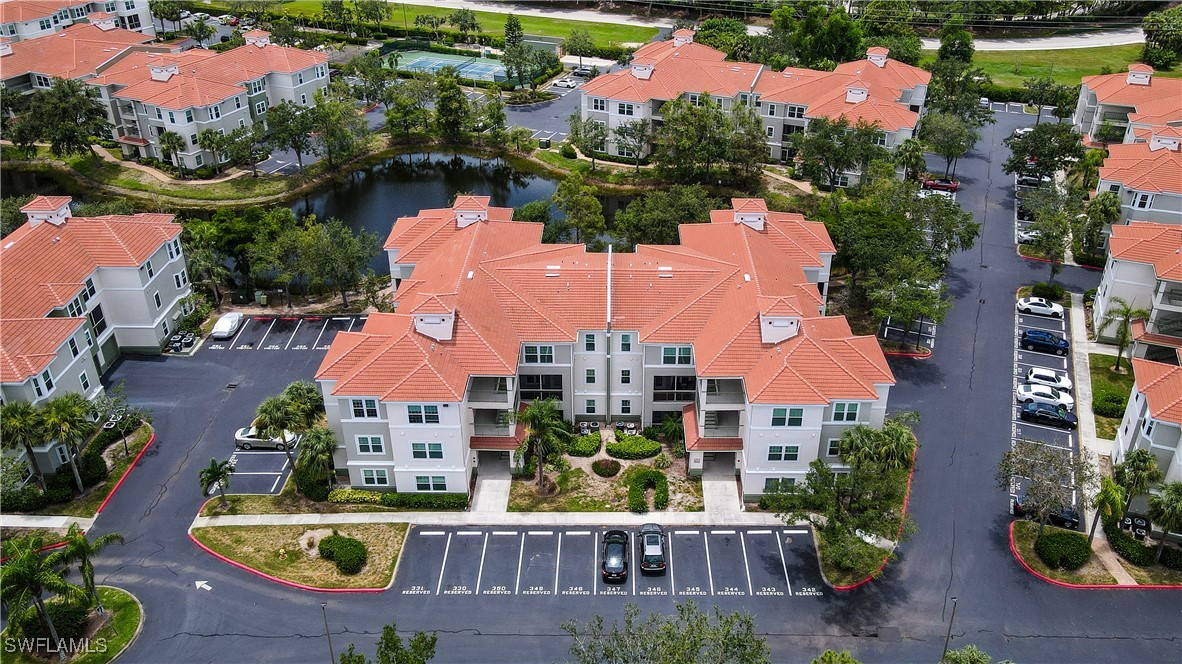 an aerial view of house with yard swimming pool and outdoor seating